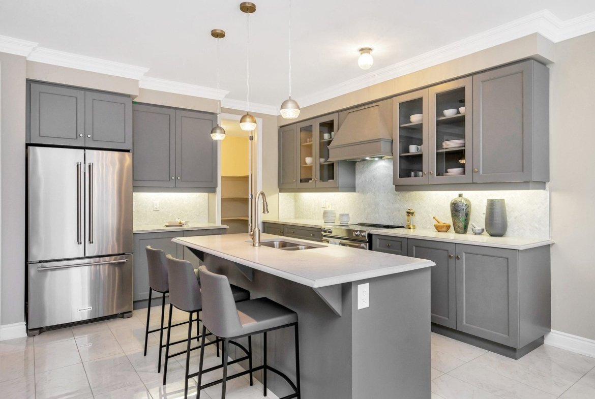 Sophisticated kitchen with custom center island and elegant cabinetry in the Gloucester model at Empire Legacy