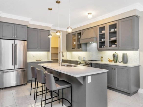 Sophisticated kitchen with custom center island and elegant cabinetry in the Gloucester model at Empire Legacy