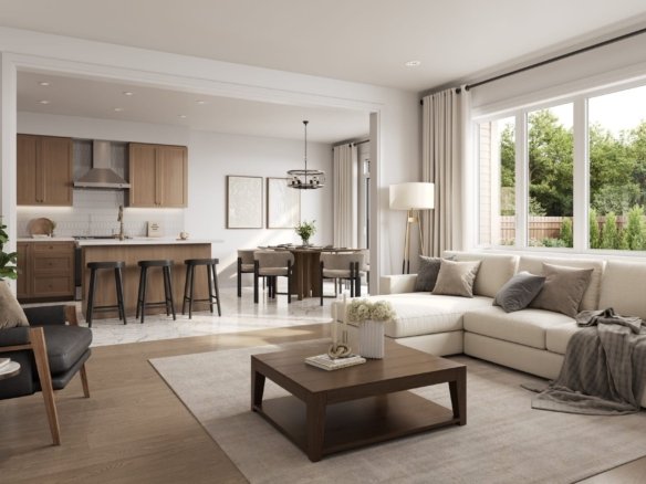 Open-concept living space and chef kitchen with quartz countertops and stainless steel appliances at Empire Legacy