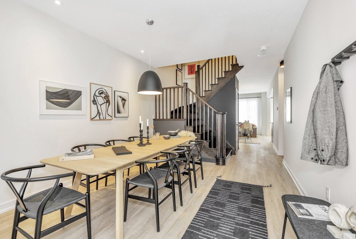 Warm and welcoming open great room ideal for family entertaining in the Tranquil model at Empire Legacy