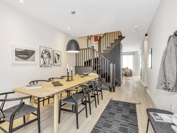 Warm and welcoming open great room ideal for family entertaining in the Tranquil model at Empire Legacy