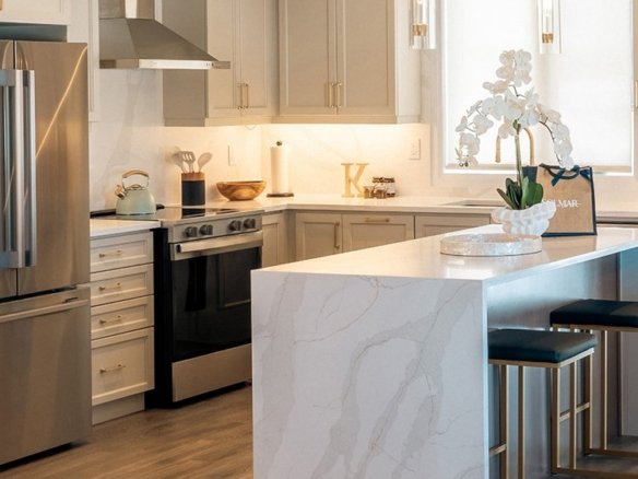 Open-concept luxury kitchen with premium cabinetry and quartz finishes at North Hill Bolton