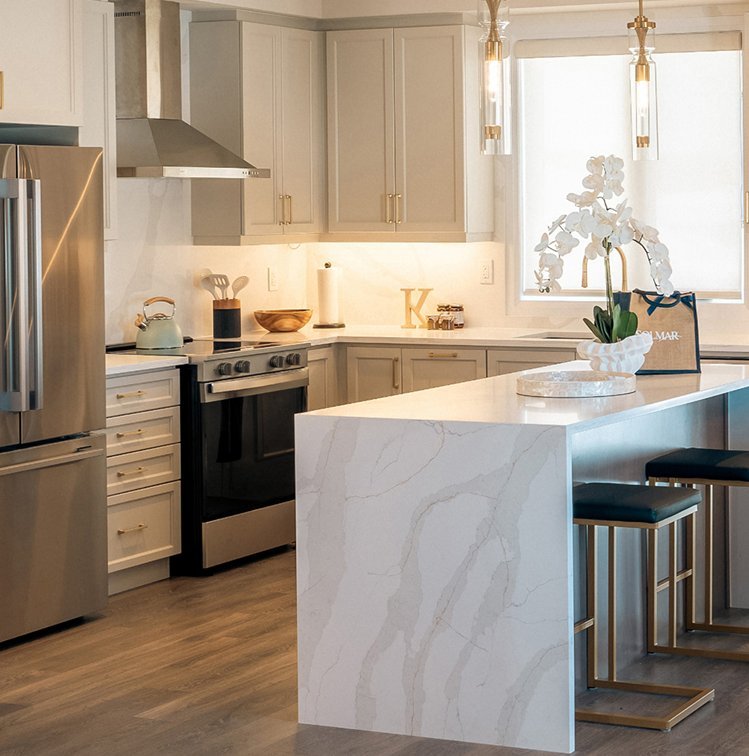 Open-concept luxury kitchen with premium cabinetry and quartz finishes at North Hill Bolton